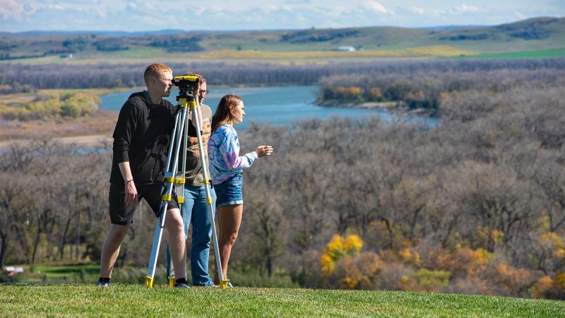 Engineering students doing survey work along the Bluff